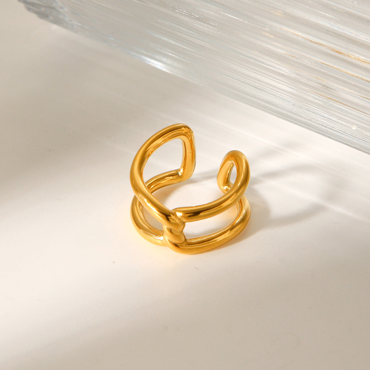 Geometric Hollow Titanium Steel Ring with Gold Plating and Knot-Cross Design for Women