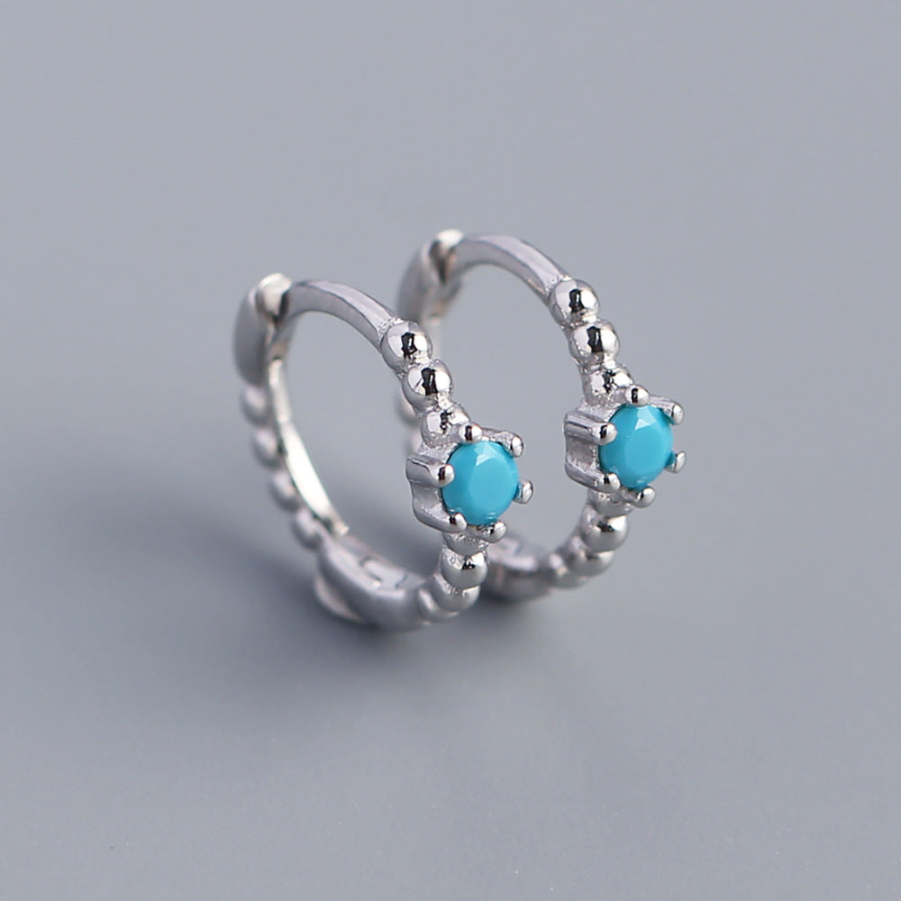 Orecchini a perno tondi con intarsi di diamanti in argento sterling 925