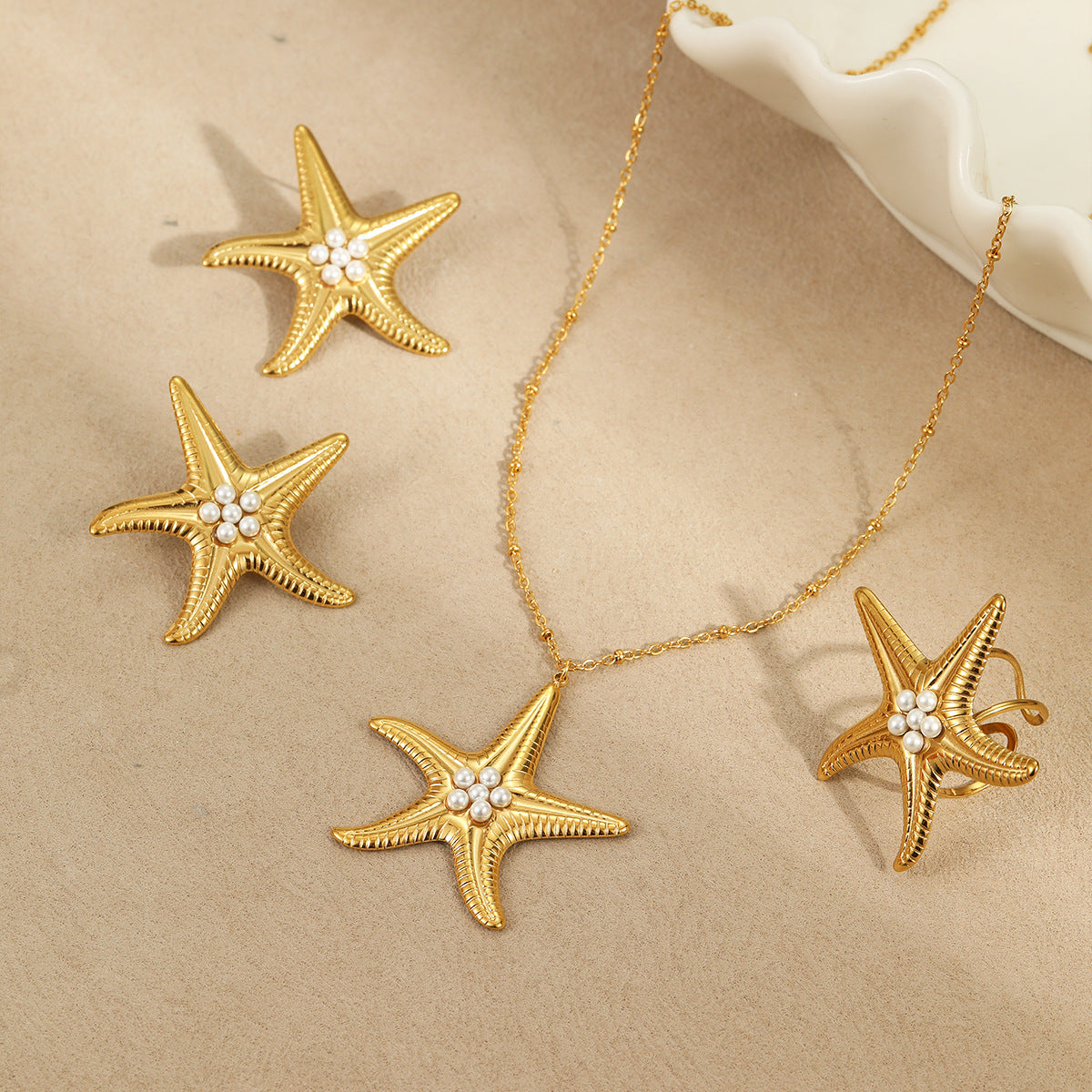 Conjunto de collar, anillo y pendientes de perlas con diseño de estrellas de mar, inspirados en el océano, de acero inoxidable con baño de oro para mujer