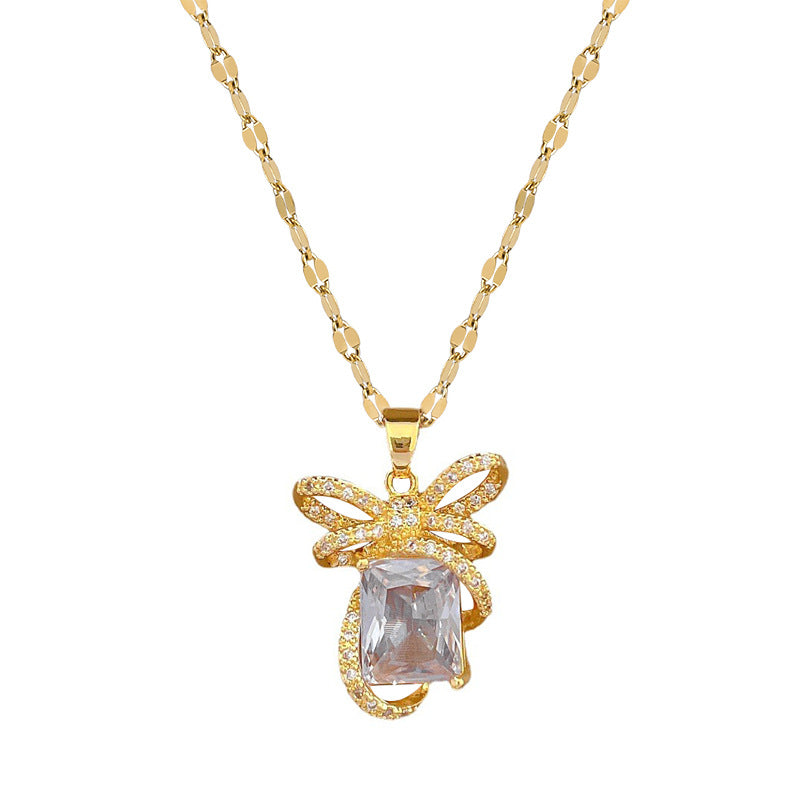 Collar de lujo con colgante de lazo para mujer en acero de titanio con incrustaciones de diamantes de imitación, forma geométrica, acabado chapado, cadena de clavícula