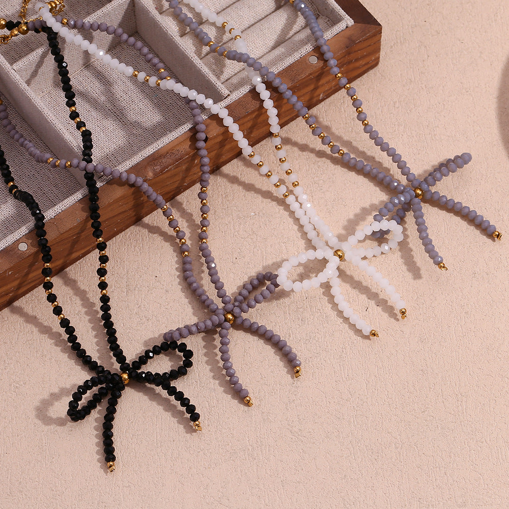Collana con ciondolo minimalista a forma di fiocco in acciaio inossidabile con strass da donna