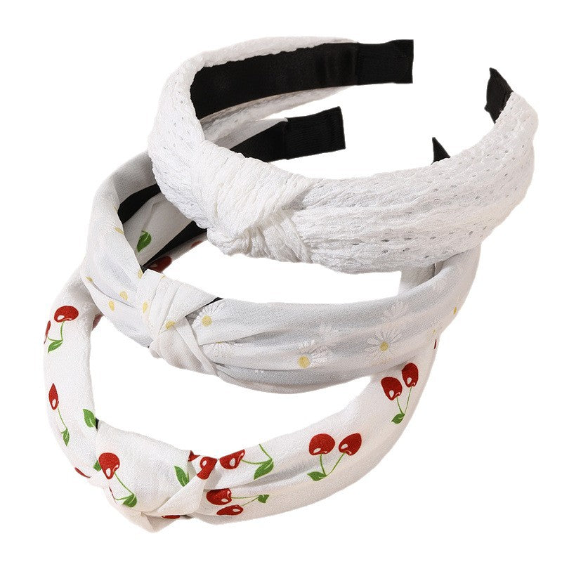 Diadema de tela ancha con estampado floral dulce para niñas con ribete de encaje y diseño geométrico