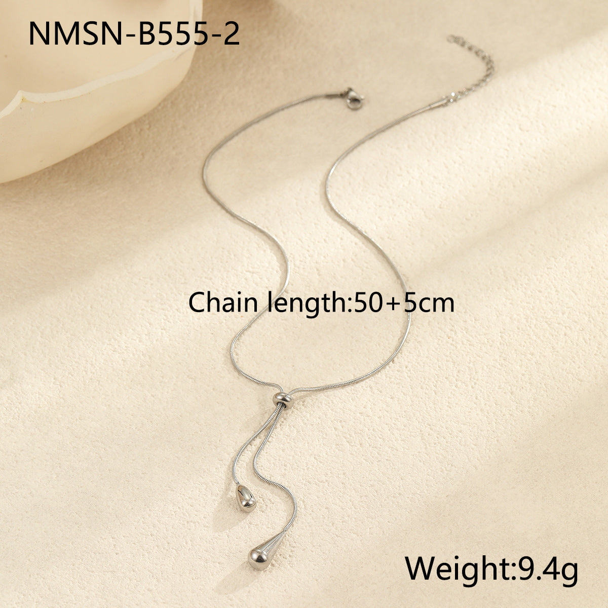 Collar minimalista con colgante de gota de acero de titanio tono frío con baño de oro para mujer