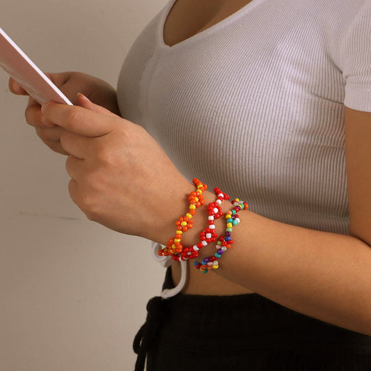 Bracciale elastico da donna con motivo floreale intrecciato e perline, con perline Miyu