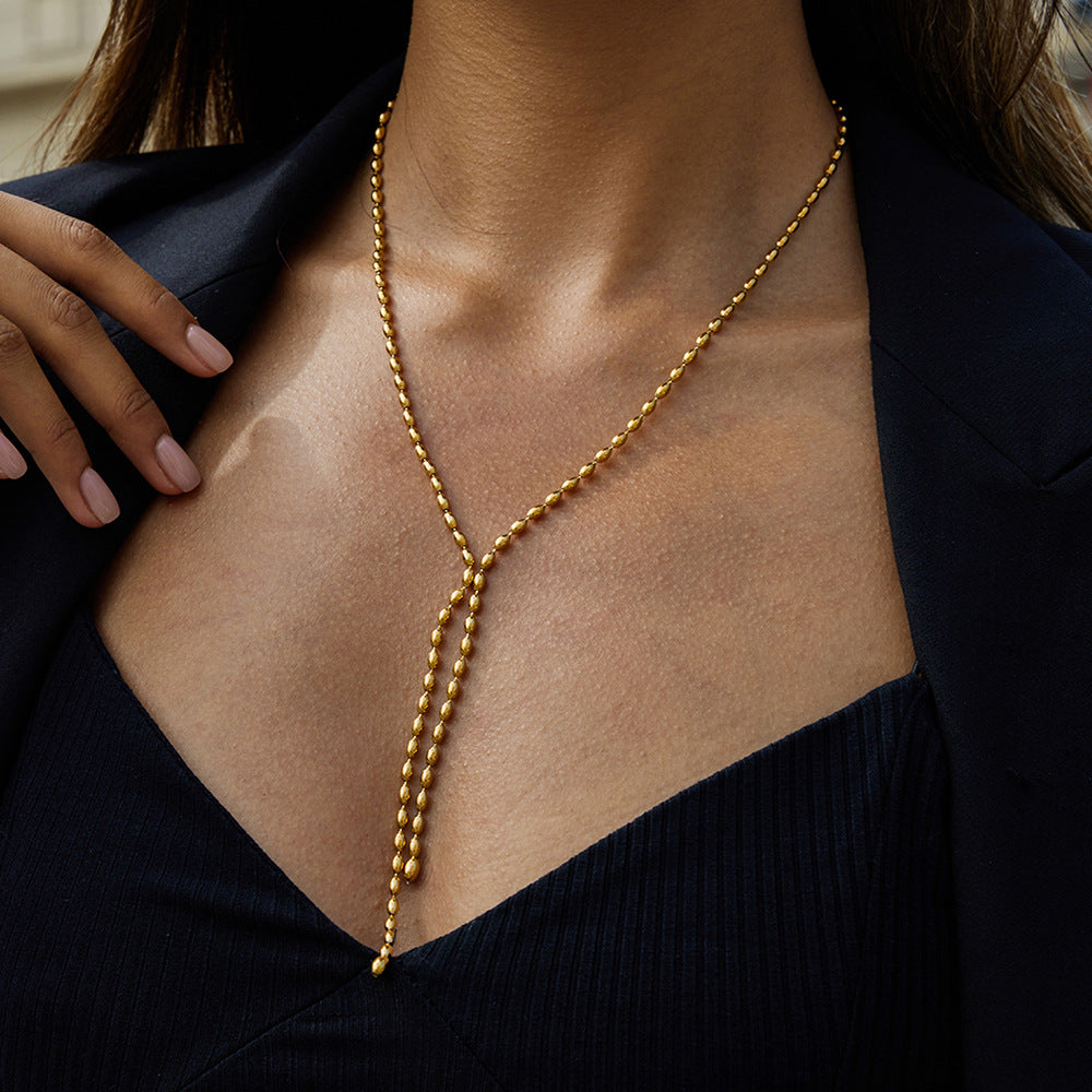Collana a Y geometrica in acciaio inossidabile con pendente in titanio e finitura placcata per donna