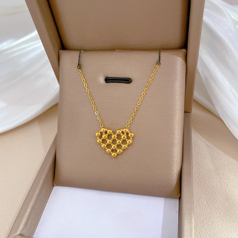 Minimalist Titanium Steel Hollow-Out Round Bead Heart Pendant Necklace for Women with Gold Plating and Geometric Design for Clavicle Styling