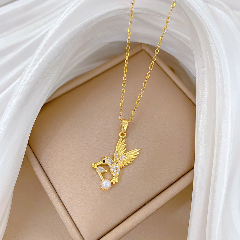 Cartoon Style Swallow-Shaped Pearl Pendant Necklace for Women with Rhinestone Accents on Titanium Steel Chain
