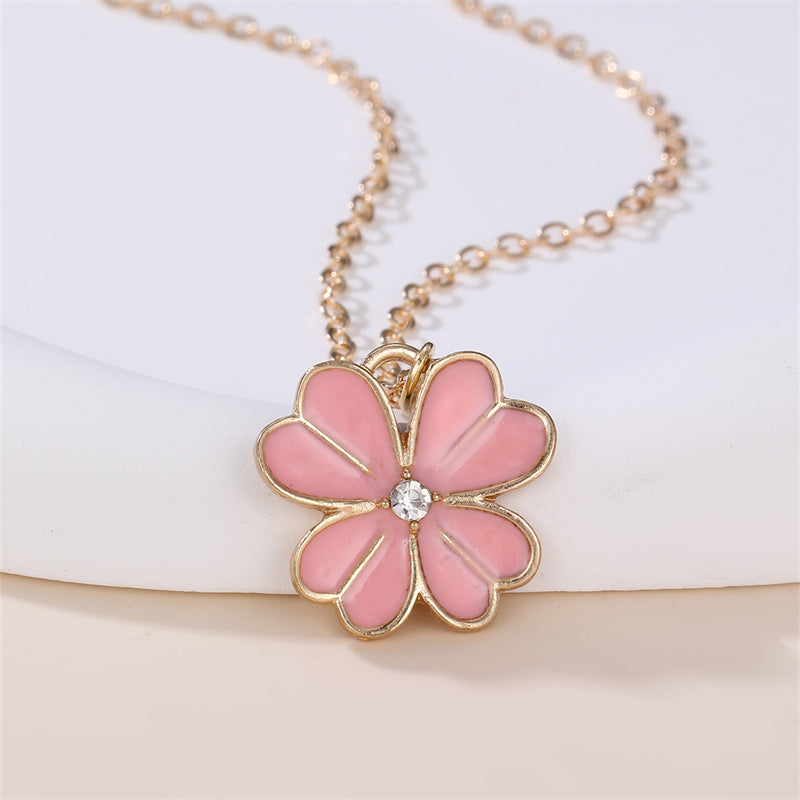 Collar con colgante esmaltado con forma de lazo floral dulce para niñas con dije de aleación y detalles de pedrería