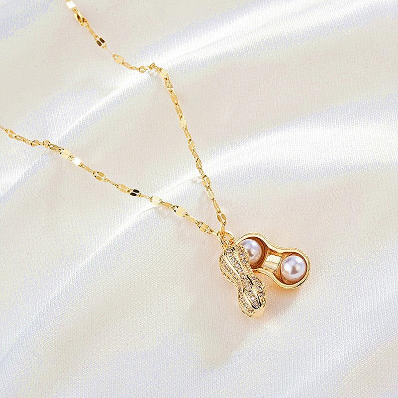 Collar con colgante minimalista de acero de titanio con forma de cacahuete y circonitas para mujer