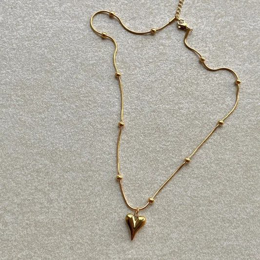Collar con colgante de acero de titanio con forma de corazón estilo princesa con acabado chapado para mujer, cadena minimalista de clavícula estilo serpiente
