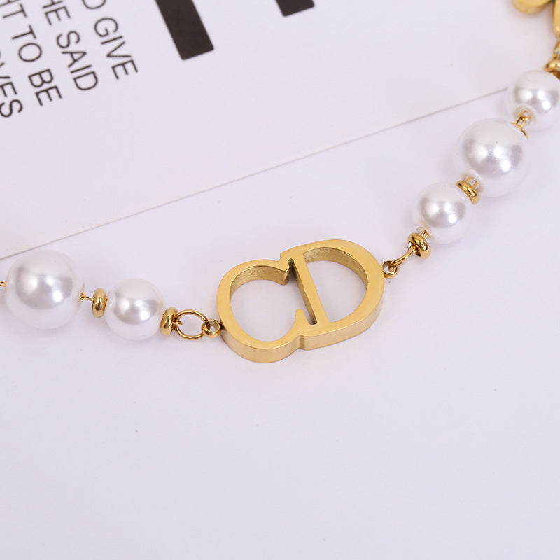 Sweet Minimalist Titanium Steel Bracelet with Gold Plated CD Star and Leaf Charms for Women
