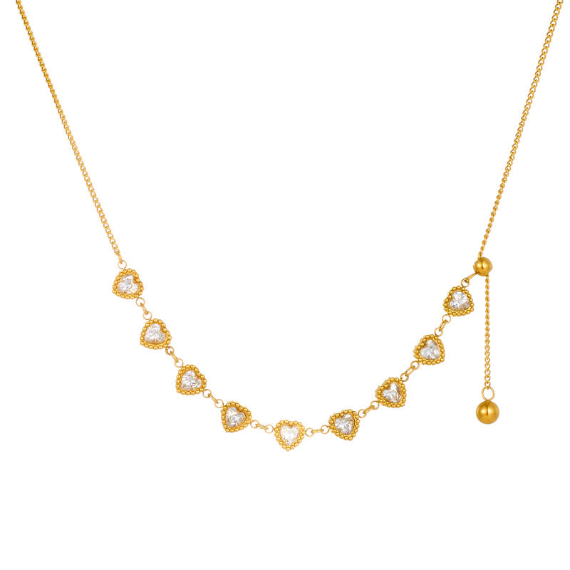 Minimalist Plated Stainless Steel Heart Pendant Necklace with Rhinestone Accents and Long Tassel Chain