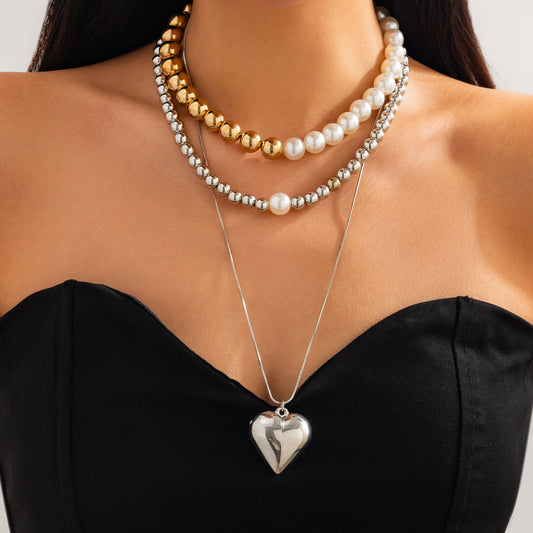 Collar con colgante de imitación de perla en forma de corazón asimétrico, dulce y atrevido, para mujer, con acabado chapado y cadena de cuentas
