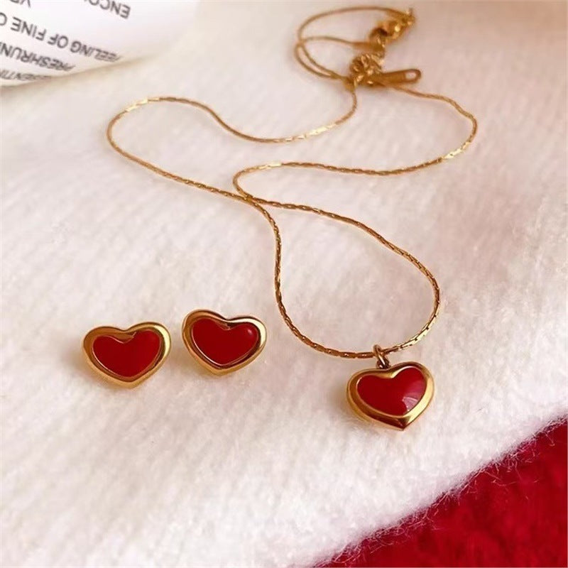 Set di collana minimalista in acciaio al titanio a forma di cuore con smalto, catena a serpente e orecchini a perno.