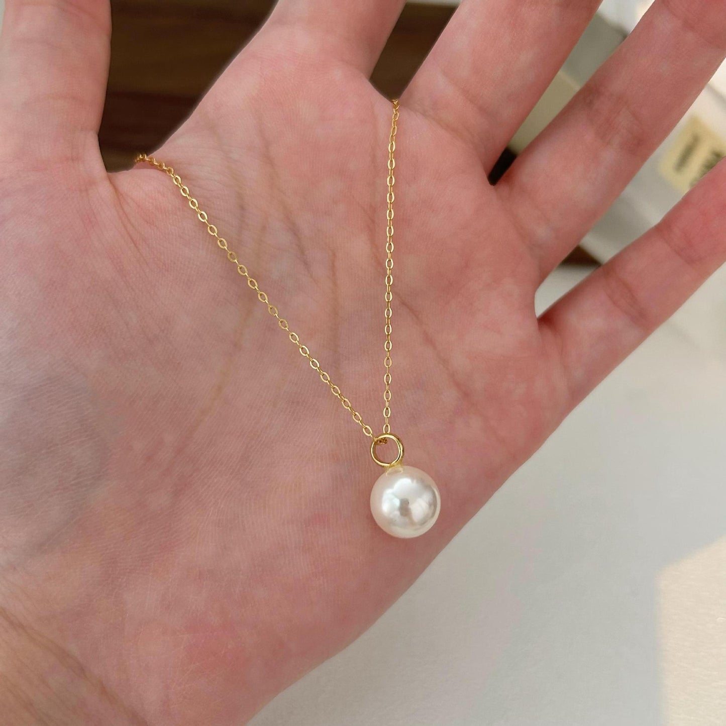 Minimalist Geometric Pearl Necklace in 925 Sterling Silver with Gold Plating on Cross Chain