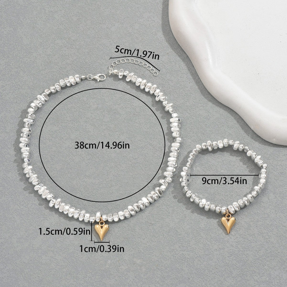Set di collana e braccialetto da donna con ciondolo a cuore geometrico in lega e finitura placcata