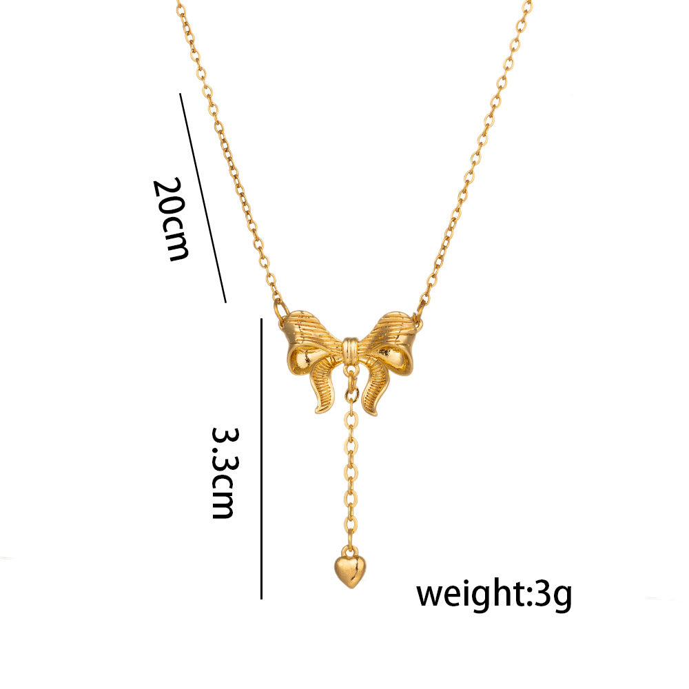 Minimalist Bowknot Tassel Heart Pendant Necklace in Titanium Steel with Vacuum Plating Snake Chain for Women