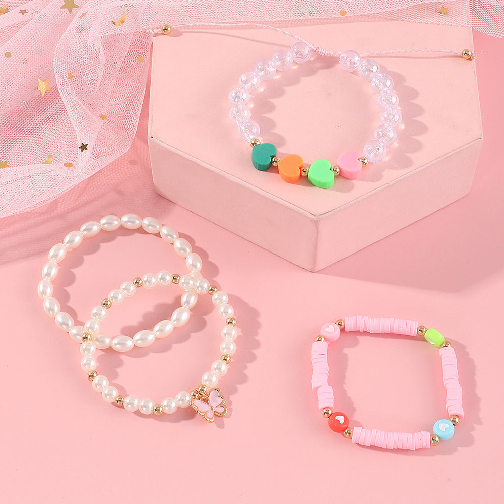Pulsera de arcilla polimérica con mariposa y corazón esmaltados hechos a mano para niñas con detalles de perlas, bonito y versátil conjunto de joyas infantiles