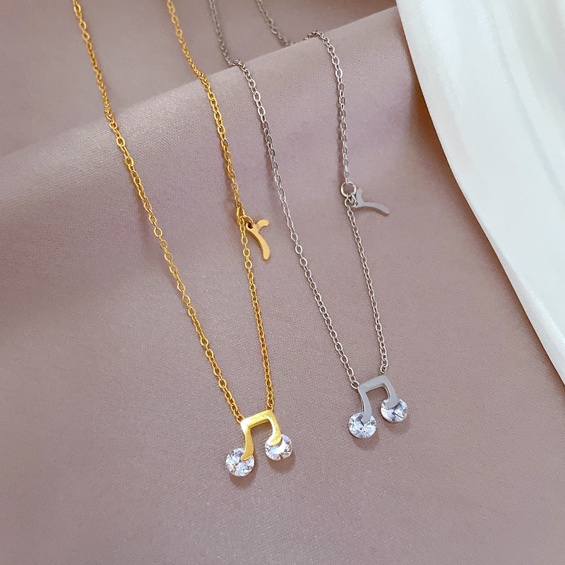 Minimalist Music Note Pendant Necklace for Women and Men in Titanium Steel with Gold Plating and Floral Motif