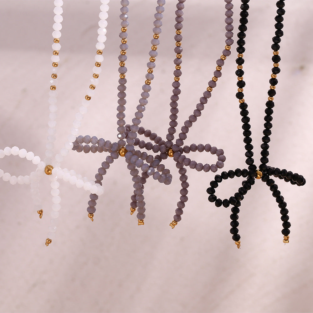 Collana con ciondolo minimalista a forma di fiocco in acciaio inossidabile con strass da donna