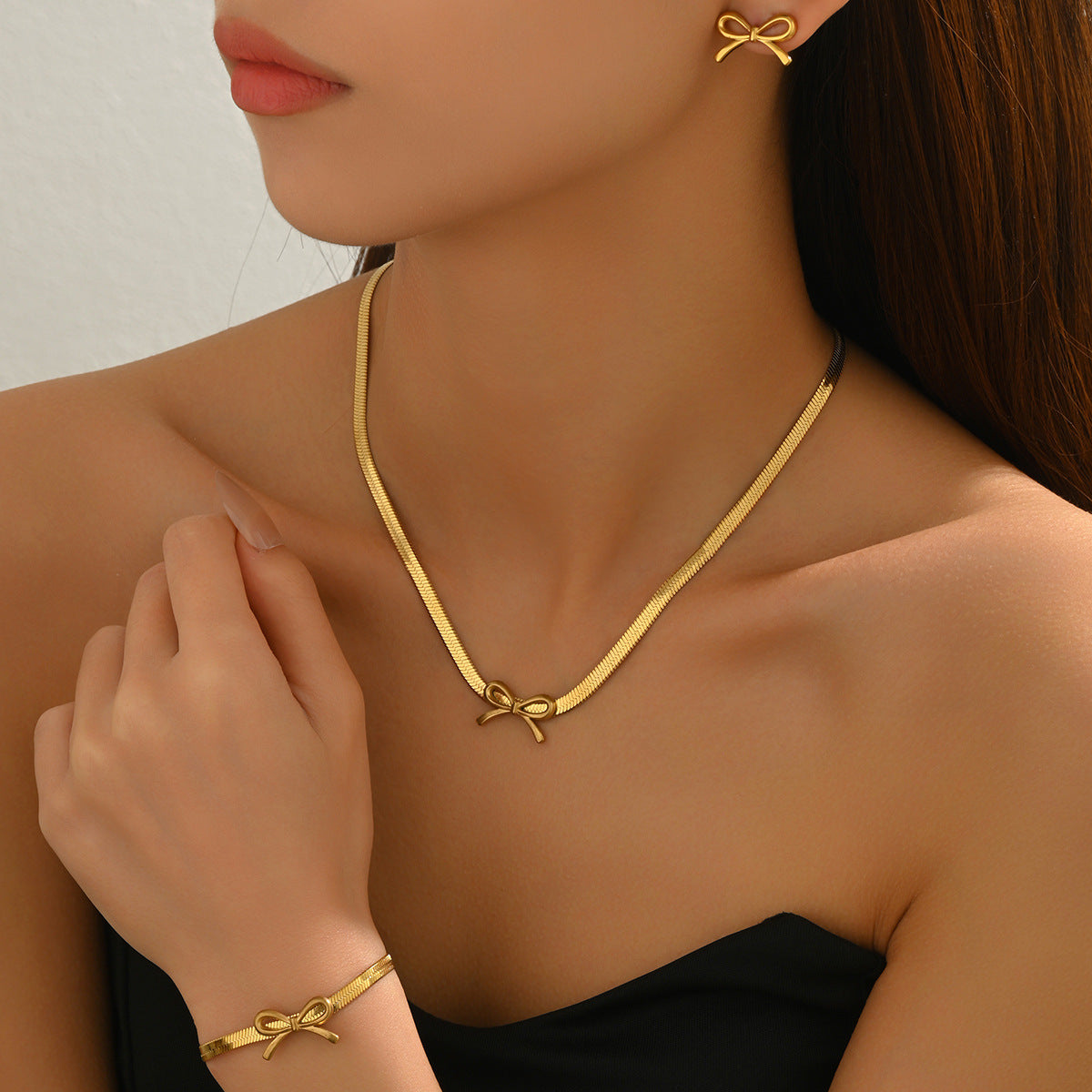 Juego de collar y aretes de diseño de lazo geométrico con baño de cobre para mujer