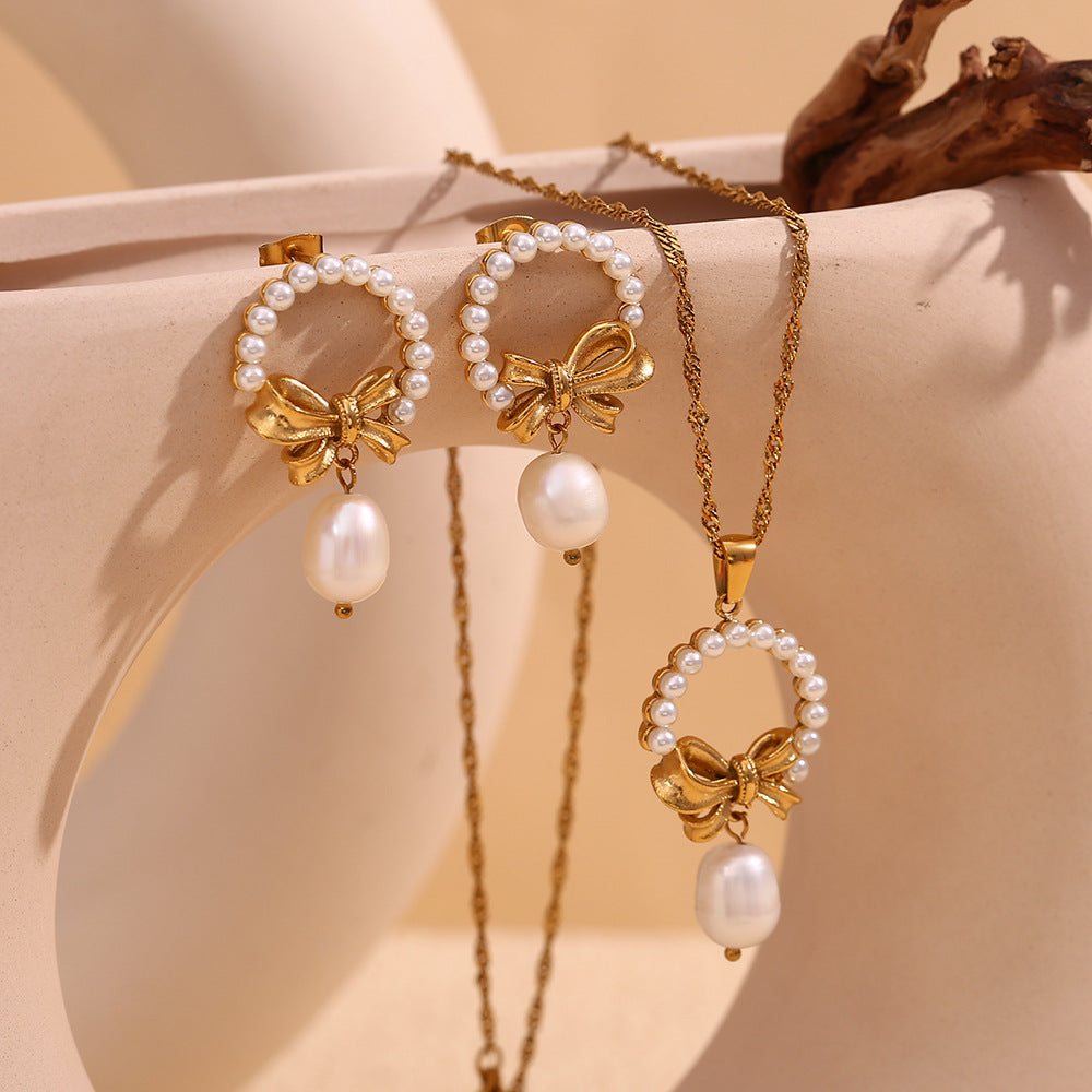 Vintage-Inspired Bow and Geometric Pendant Necklace for Women in Stainless Steel with 18K Gold Plating and Pearl Accents