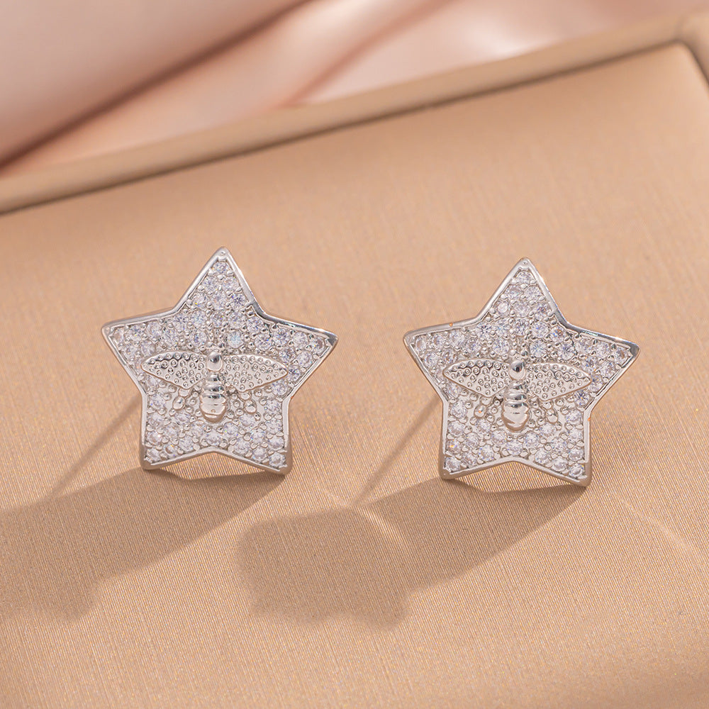 Orecchini a perno Saturno minimalisti color oro in ottone con zirconi per donna