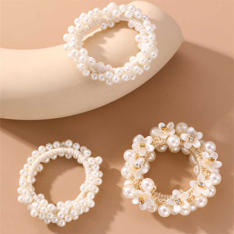 Juego de gomas de pelo florales minimalistas para niños con detalles de perlas y estructura de resina