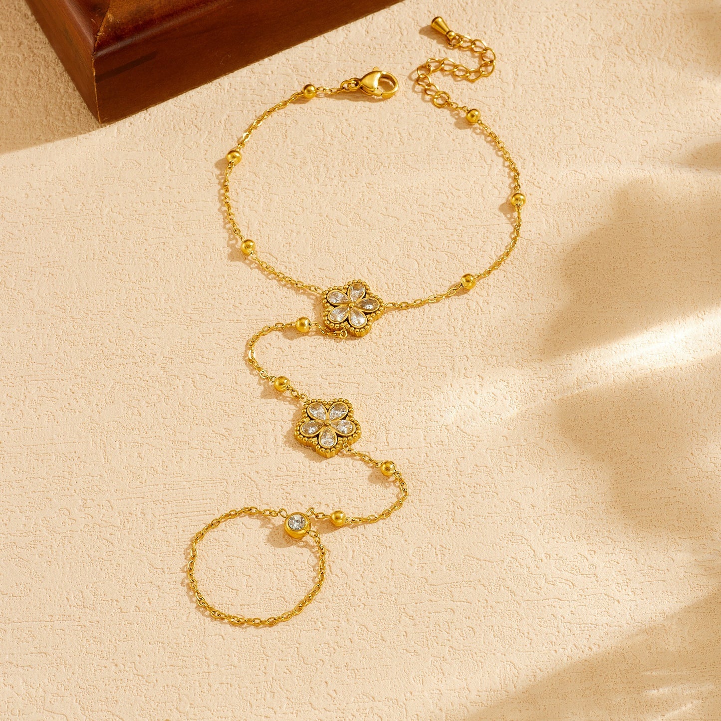 Minimalist Elegant Gold Plated Stainless Steel Floral Rhinestone Hand Chain with Tassel