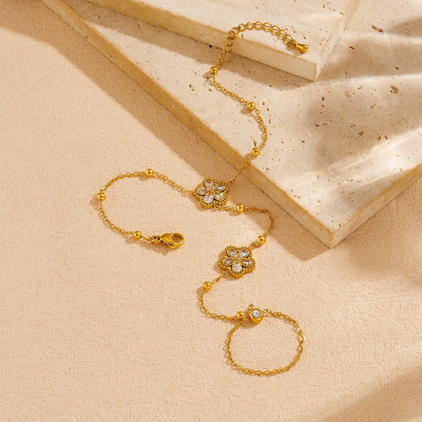 Minimalist Elegant Gold Plated Stainless Steel Floral Rhinestone Hand Chain with Tassel