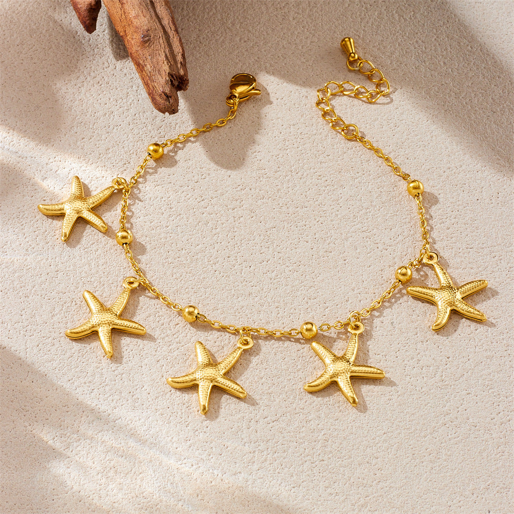 Tropical Ocean Style Gold Plated Stainless Steel Bracelet with Starfish and Tropical Fish Charms for Women