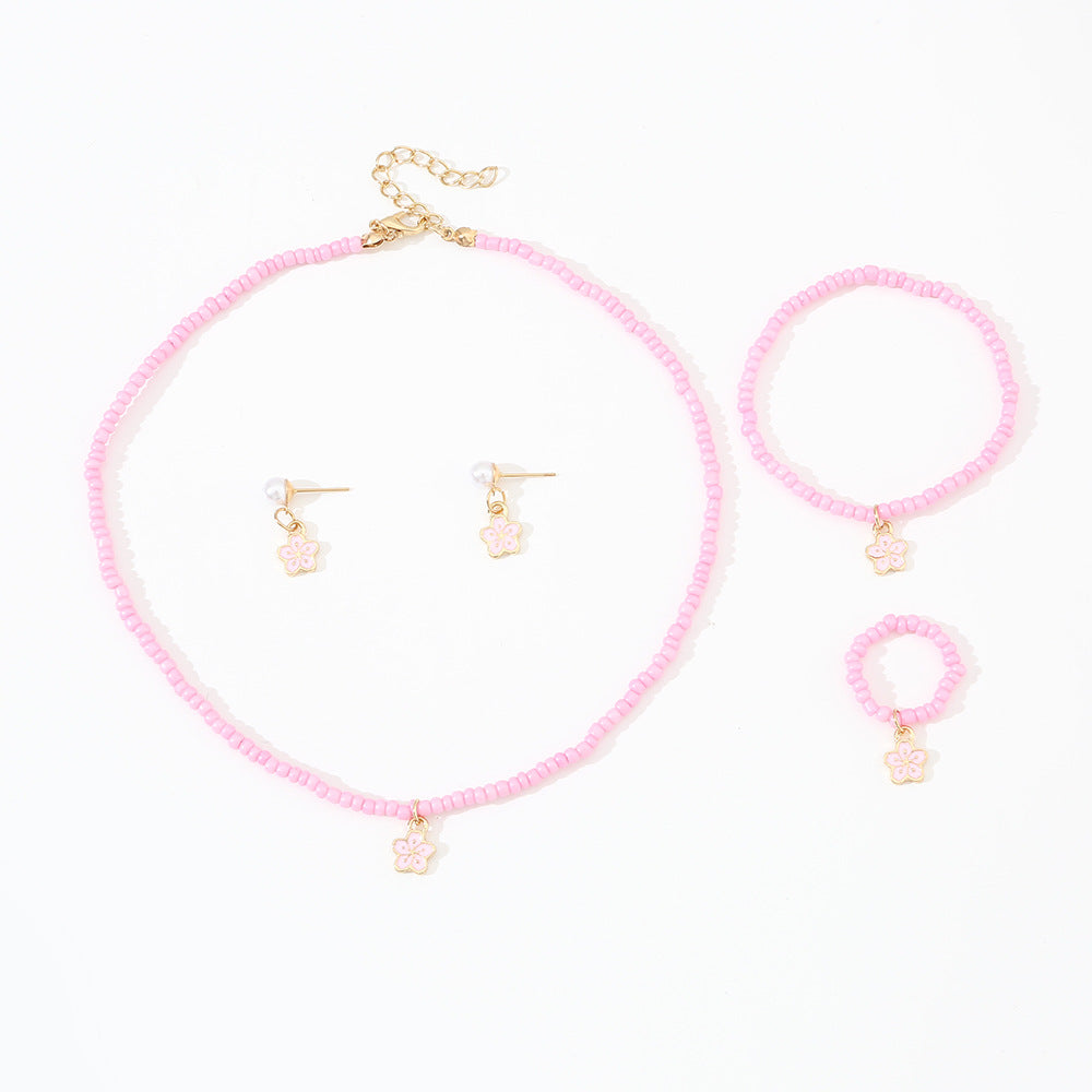 Set di collana con perline di vetro floreali minimaliste carine con bracciale anello e orecchini abbinati per bambini