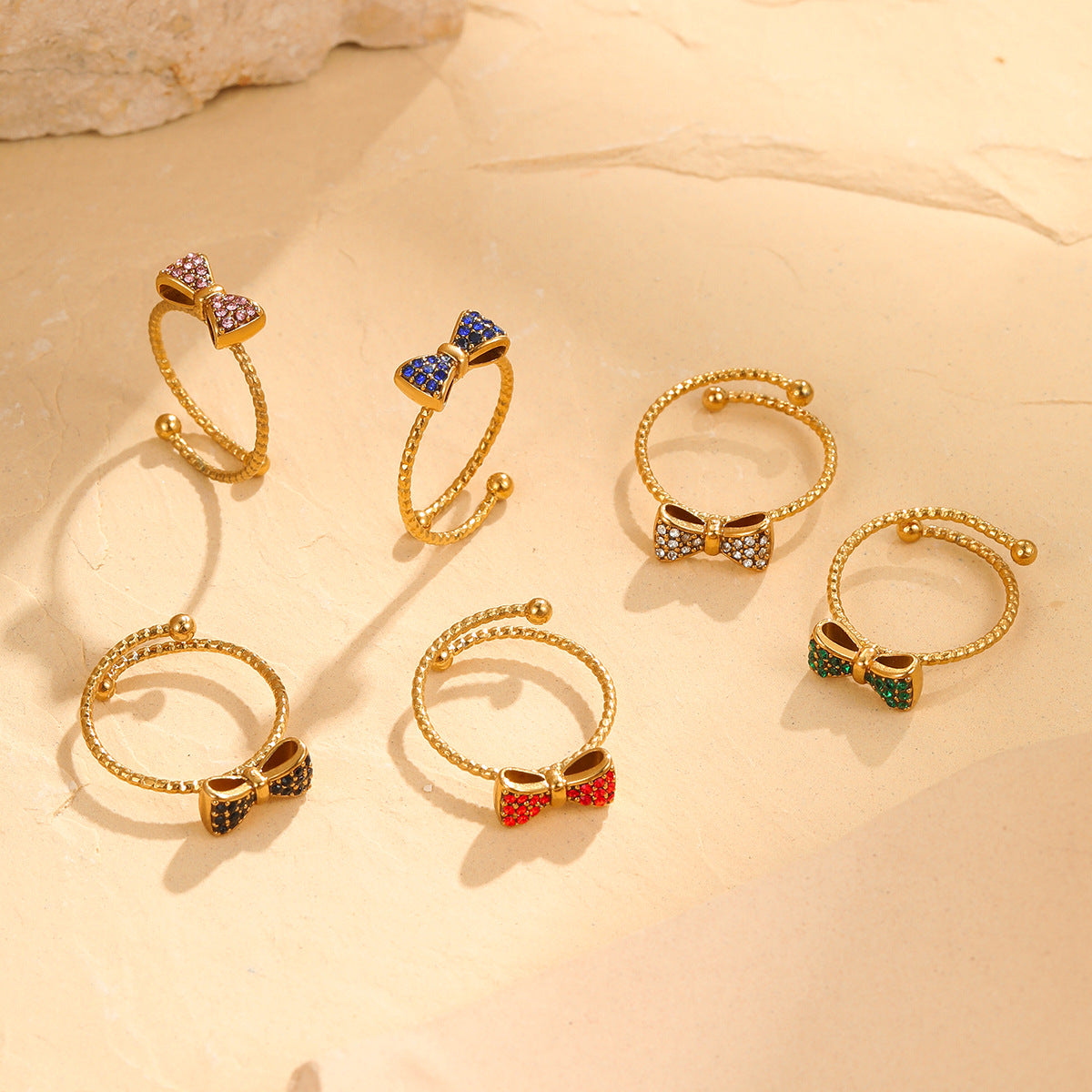 Anillo de acero inoxidable con forma de lazo, engaste de diamantes de imitación, estilo minimalista y lujoso para mujer