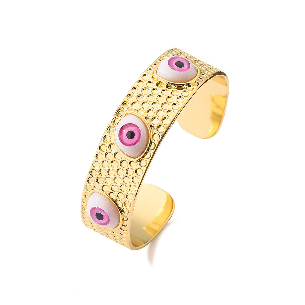 Bracciale rigido aperto geometrico da donna con base in rame e placcatura in oro 18 carati con design a occhio di Allah