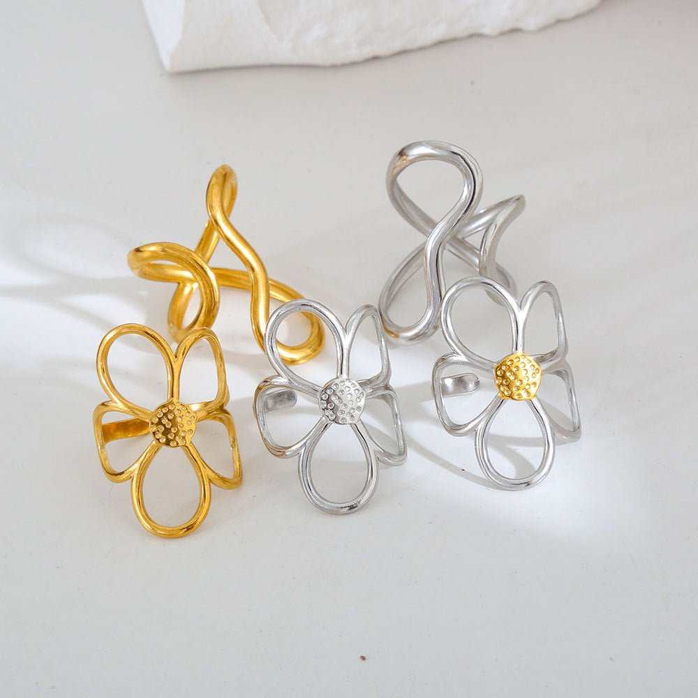 Anillo de acero de titanio abierto con diseño floral dulce y atrevido y pendientes de acero inoxidable con acabado chapado