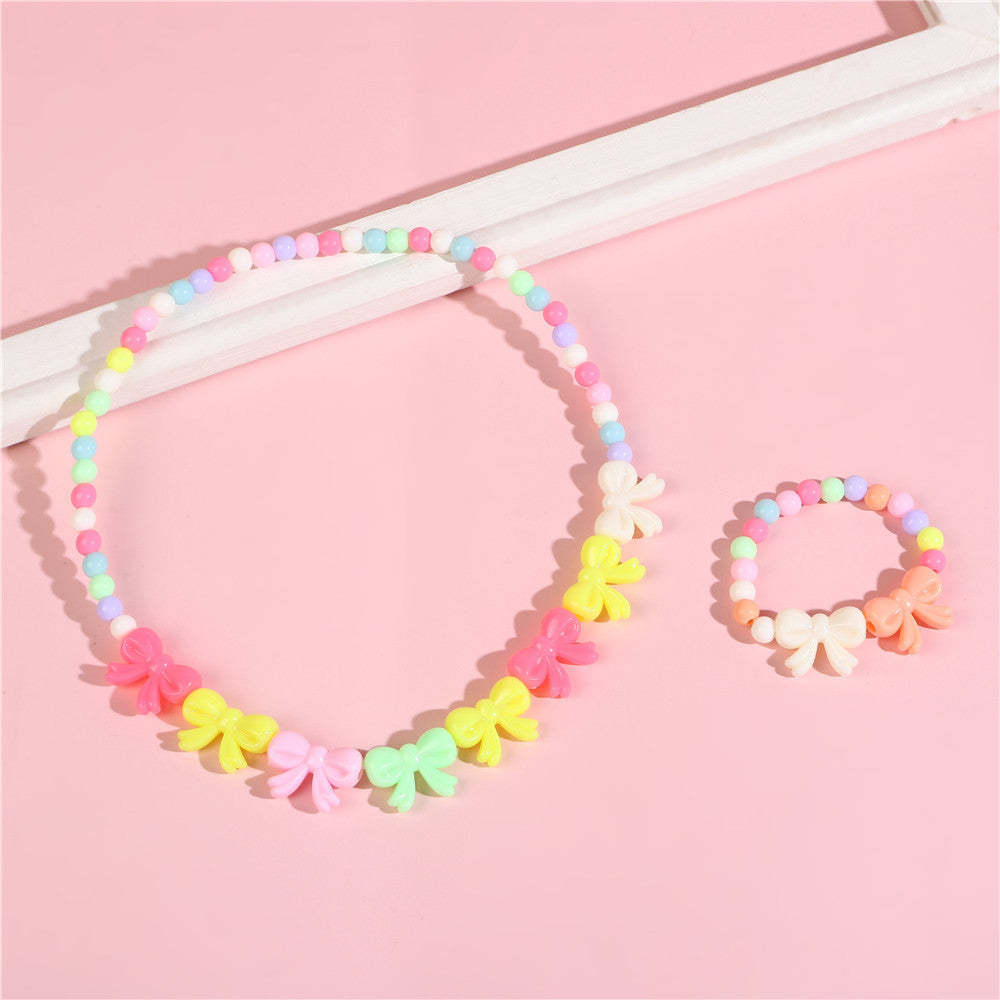 Set di collana e bracciale per bambini con perline, ciondoli a fiocco e fiore, fatti a mano in resina, per bambini da 0 a 10 anni