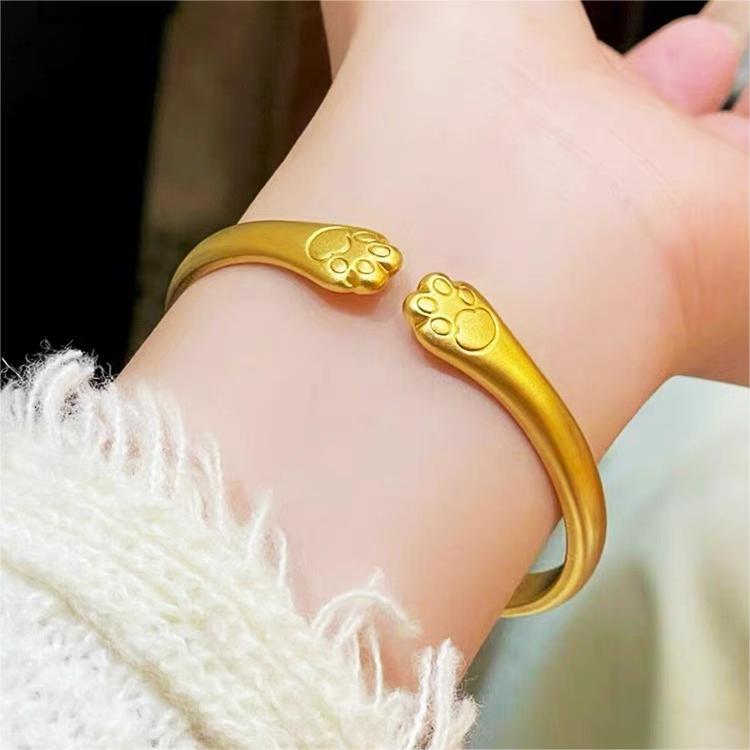 Bracciale a forma di zampa di gatto carino in rame placcato oro per donna con design delicato ed elegante