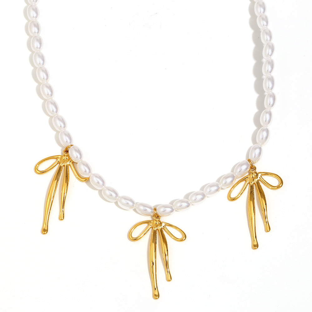 Fashionable Bowknot Pendant Necklace for Women in Stainless Steel with 18K Gold Plating and Imitation Pearl Accent