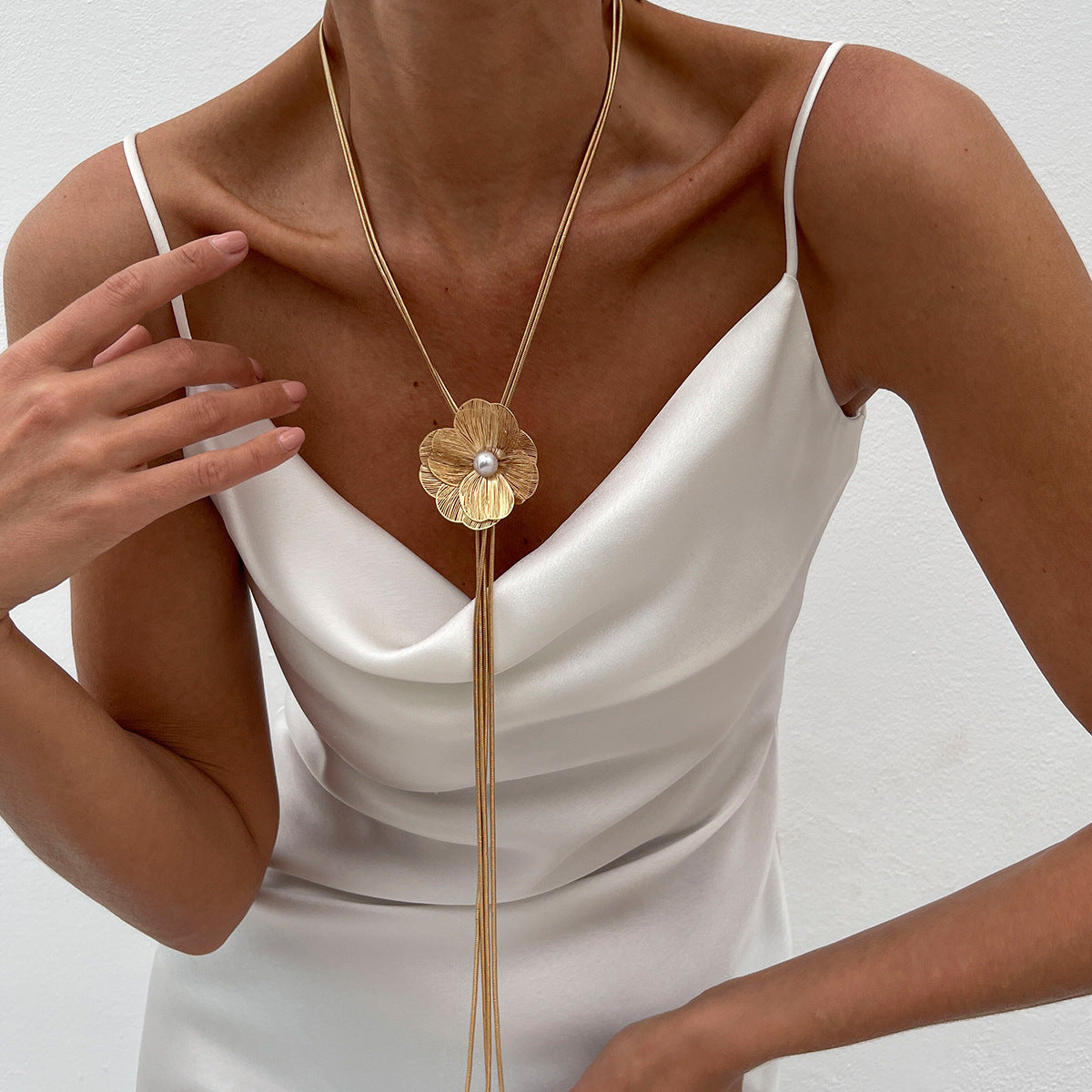 Minimalist Ginkgo Leaf Long Tassel Necklace with Hollow Floral Pendant, Electroplated Copper Chain and Simulated Pearl Accents for Women