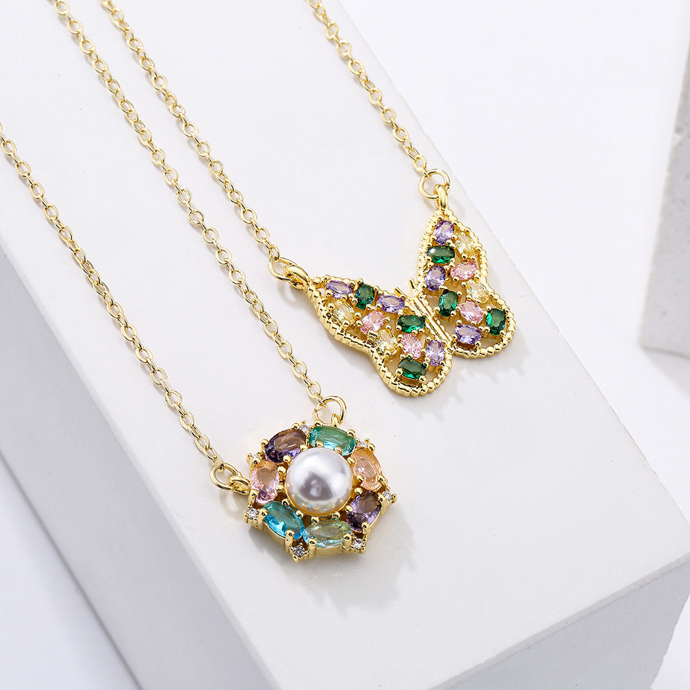 Minimalist Butterfly-Shaped Geometric Pendant Necklace for Women with Gold-Plated Copper Base and Micro-Paved Zirconia and Pearl Accents