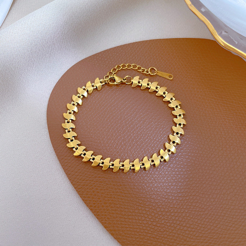 Minimalist Dart-Shaped Titanium Steel Bracelet for Women with Gold Plating and Wavy Texture