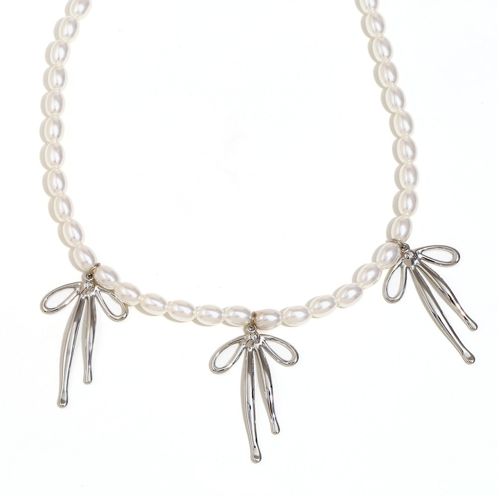 Fashionable Bowknot Pendant Necklace for Women in Stainless Steel with 18K Gold Plating and Imitation Pearl Accent
