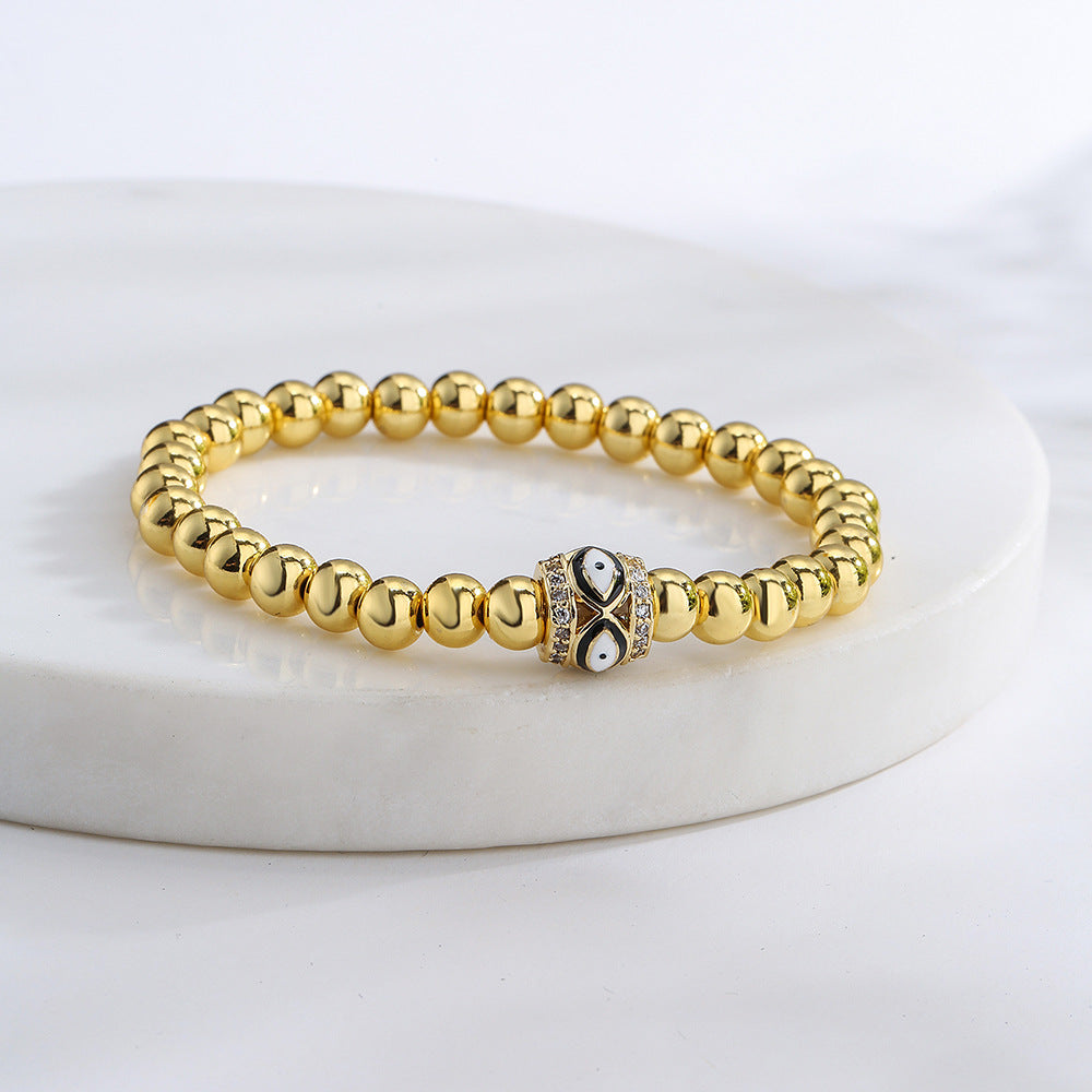 Bracciale sottile da donna geometrico minimalista con amuleto dell'occhio di Allah, base in rame placcato oro 18 carati e zirconia incastonata con smalto