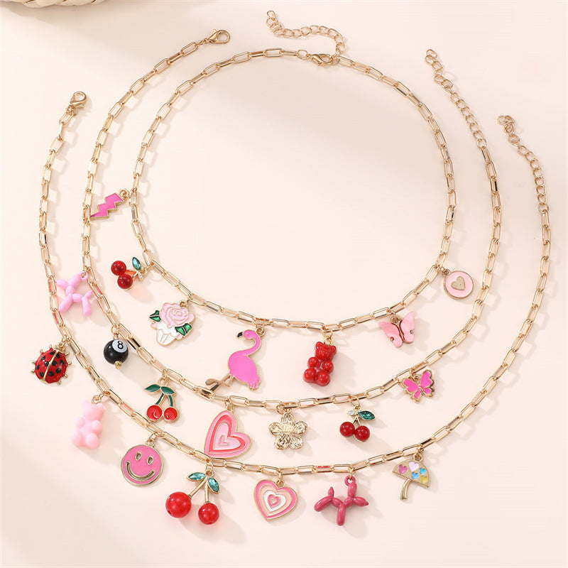 Collana a forma di fiocco minimalista in lega per bambine con finitura smaltata, catena regolabile con perline rotonde, collana con ciondolo stile principessa per bambini