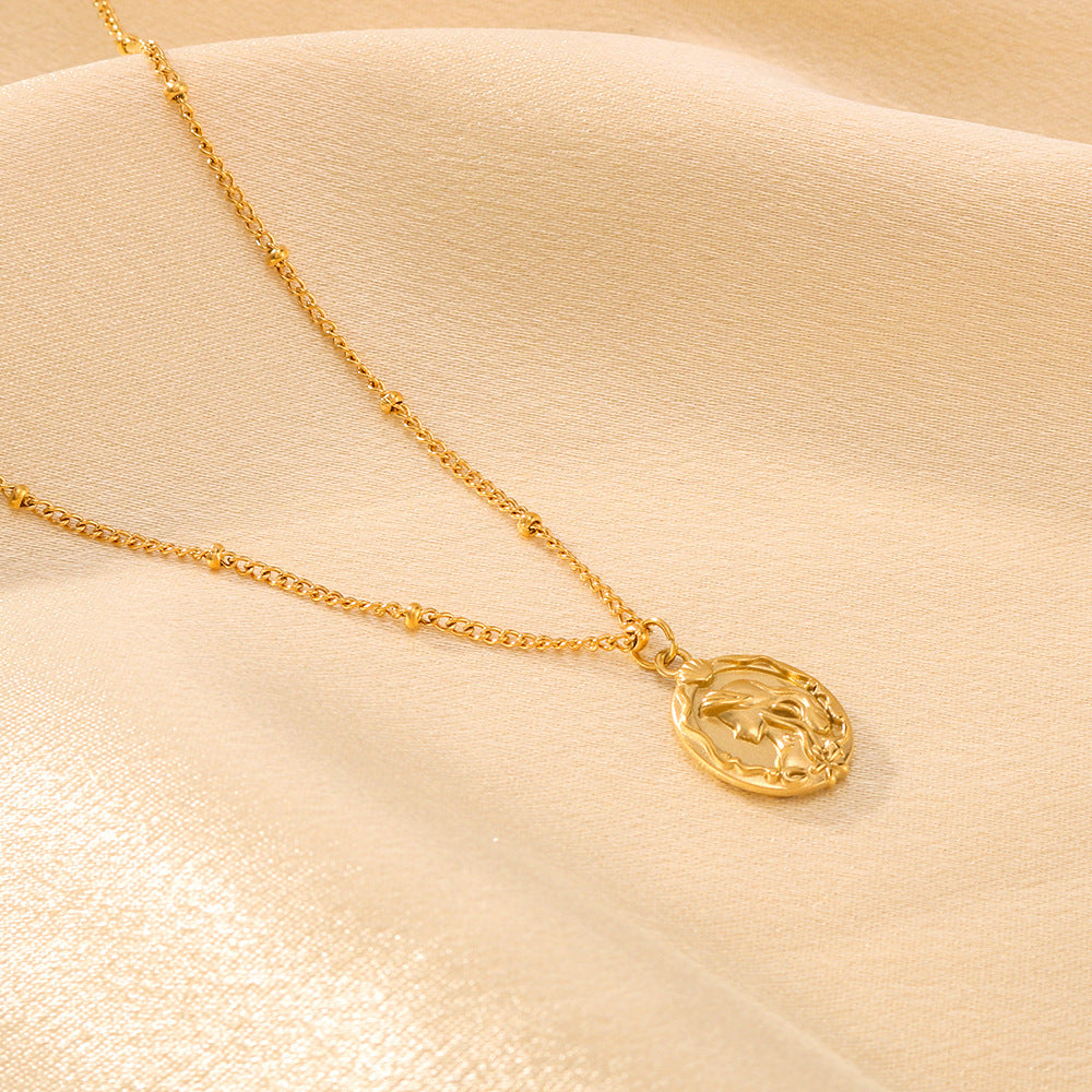 Collana da donna a doppio lato con sirena minimalista in acciaio al titanio, con catena a maglie in oro