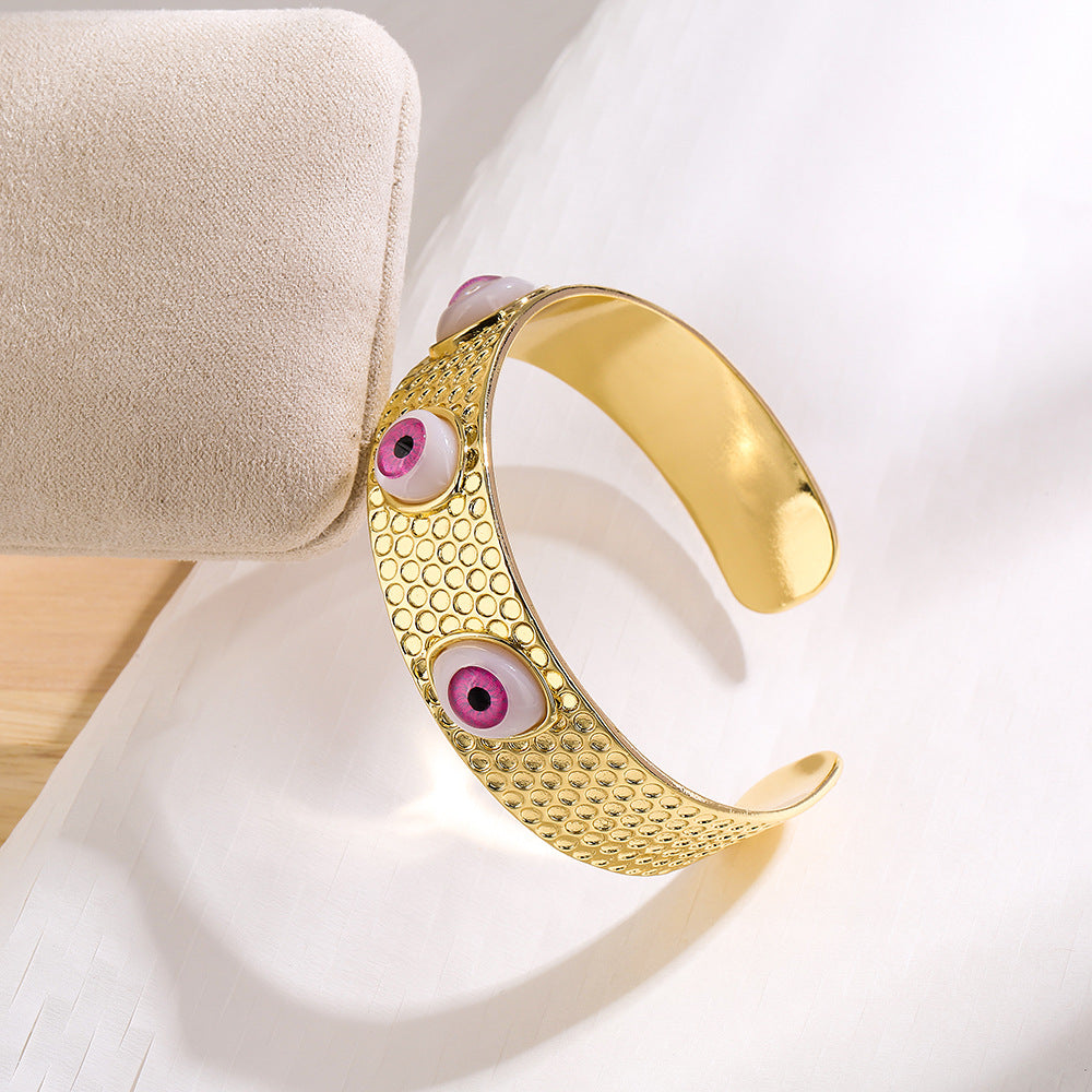 Bracciale rigido aperto geometrico da donna con base in rame e placcatura in oro 18 carati con design a occhio di Allah