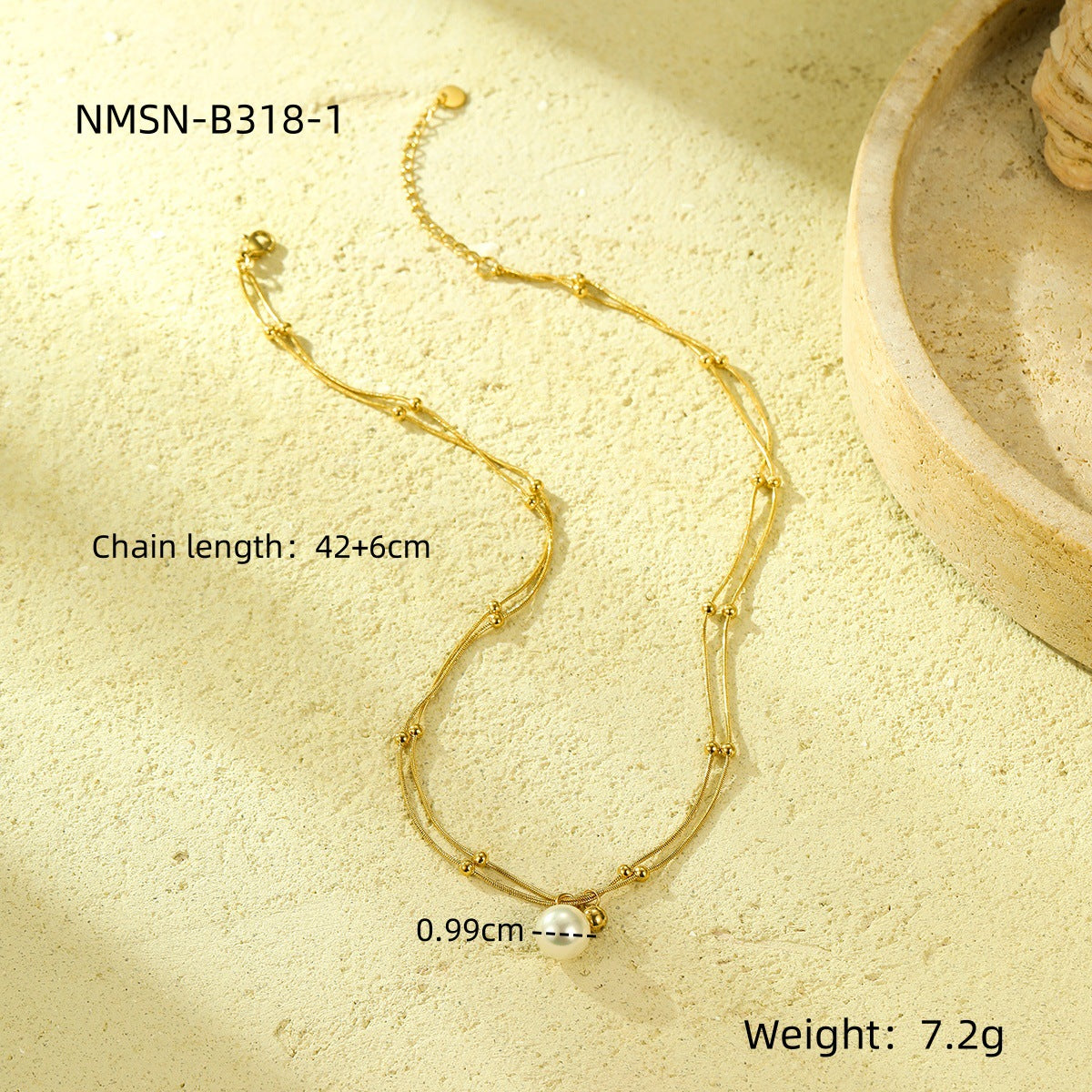 Collana minimalista con perle, doppia catena in acciaio al titanio e design con clavicola placcata in oro 18 carati