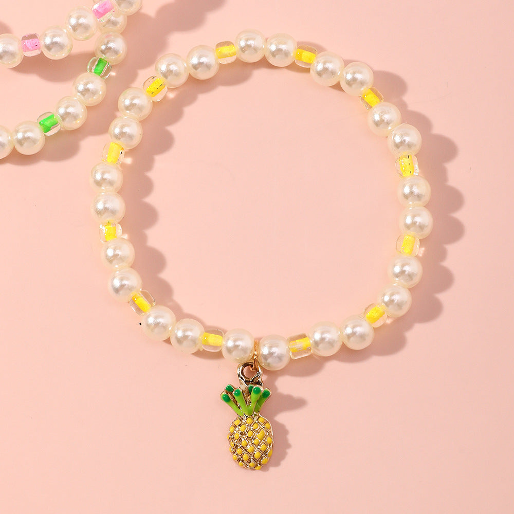 Juego de pulseras infantiles con forma de fruta estilo caricatura, con detalles de perlas y base de aleación para niñas de 6 a 10 años