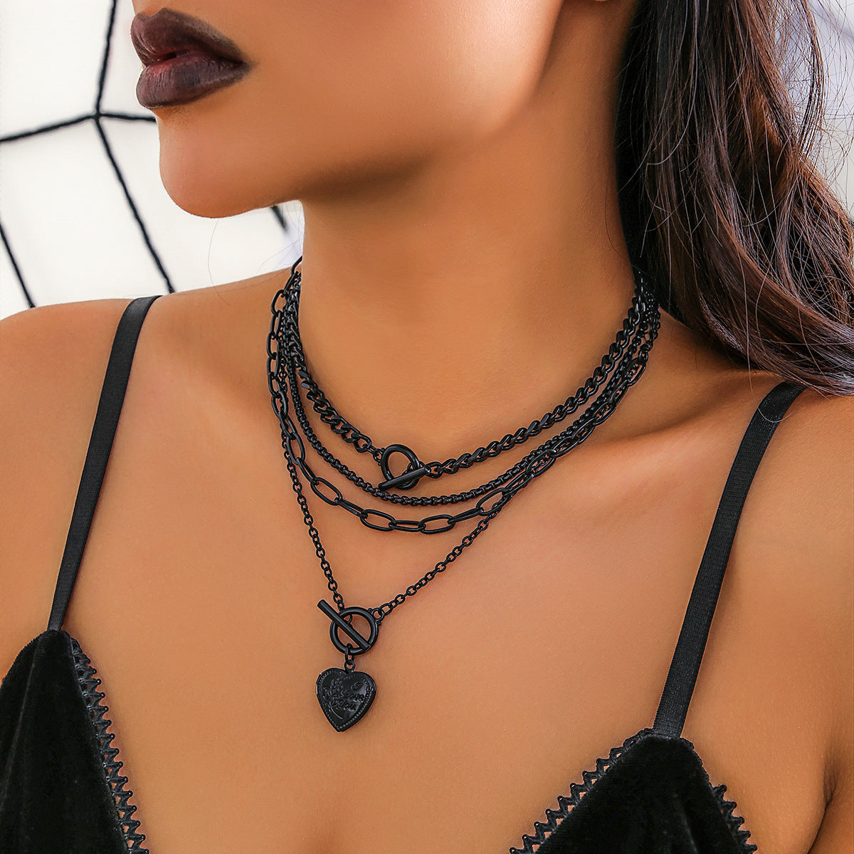Sweet and Edgy Black Heart Pendant Necklace for Women with Zinc Alloy Construction Electroplated Finish and Cross Chain Style