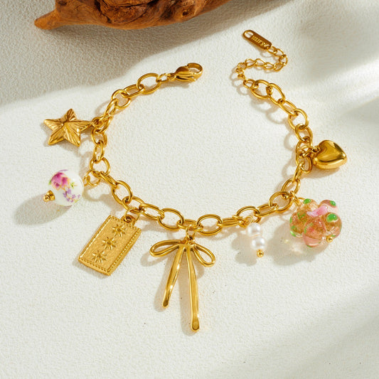 Sweet Gold Plated Stainless Steel Bracelet with Bow and Star Ceramic Charms